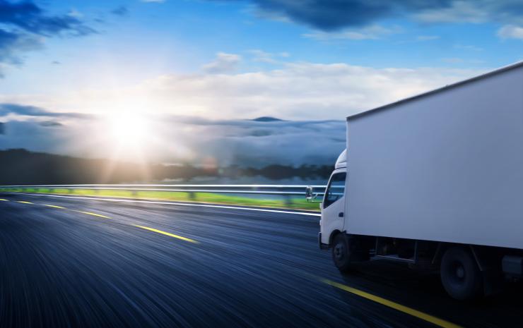 truck driving across road